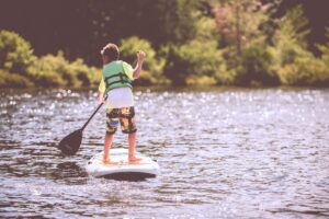 Kid paddleboarding